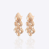 Sundown Flora Earrings in 18K gold with central Polki encircled by diamonds.