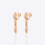 Sundown Flora Earrings in 18K gold with central Polki encircled by diamonds.