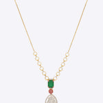 14K gold necklace with teardrop Polki, ruby, and green stone accents.