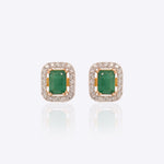Rectangular stud earrings with a green center stone and diamonds