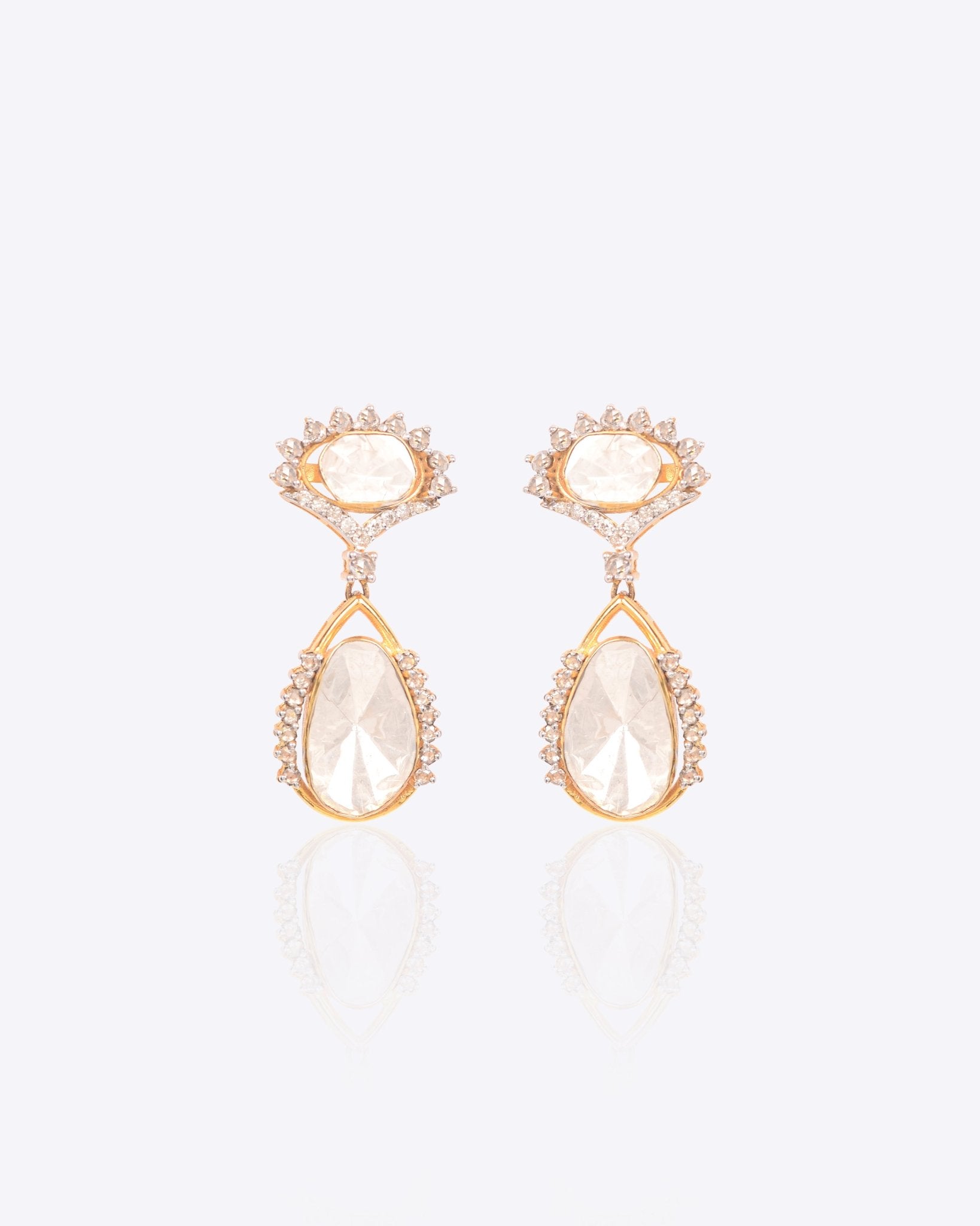 18k gold drop earrings with circular Polki diamonds in a gardenia-inspired frame.