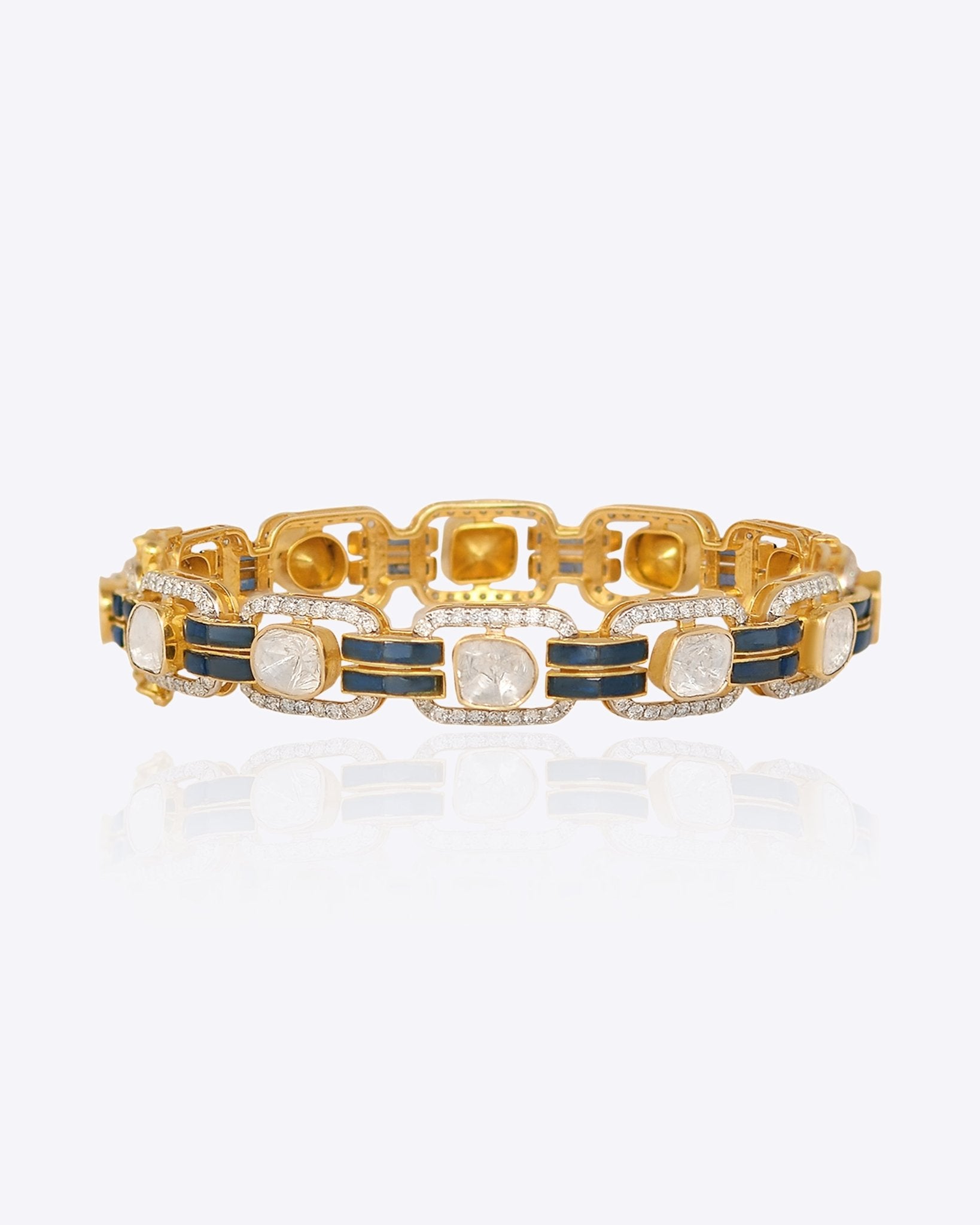 14K gold wristlet with blue talaf stones and sparkling Polki diamonds.