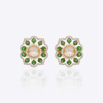 14K gold floral drop earrings set with Polki diamonds and emerald accents.
