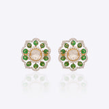 14K gold floral drop earrings set with Polki diamonds and emerald accents.