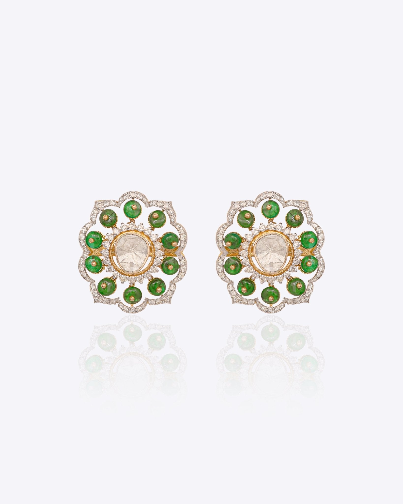 14K gold floral drop earrings set with Polki diamonds and emerald accents.