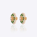 14K gold floral drop earrings set with Polki diamonds and emerald accents.