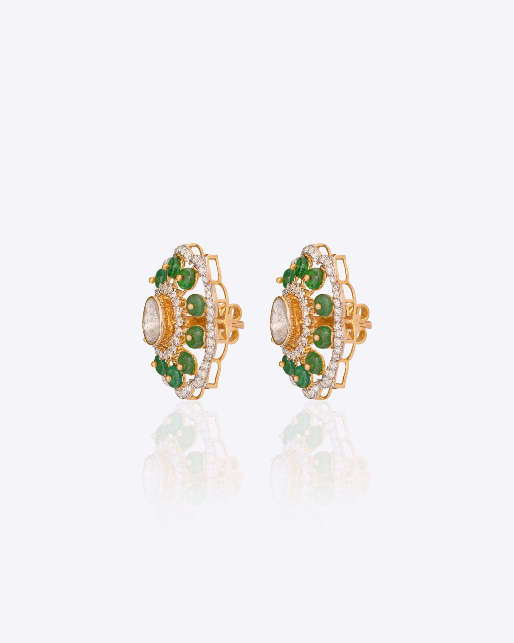 14K gold floral drop earrings set with Polki diamonds and emerald accents.