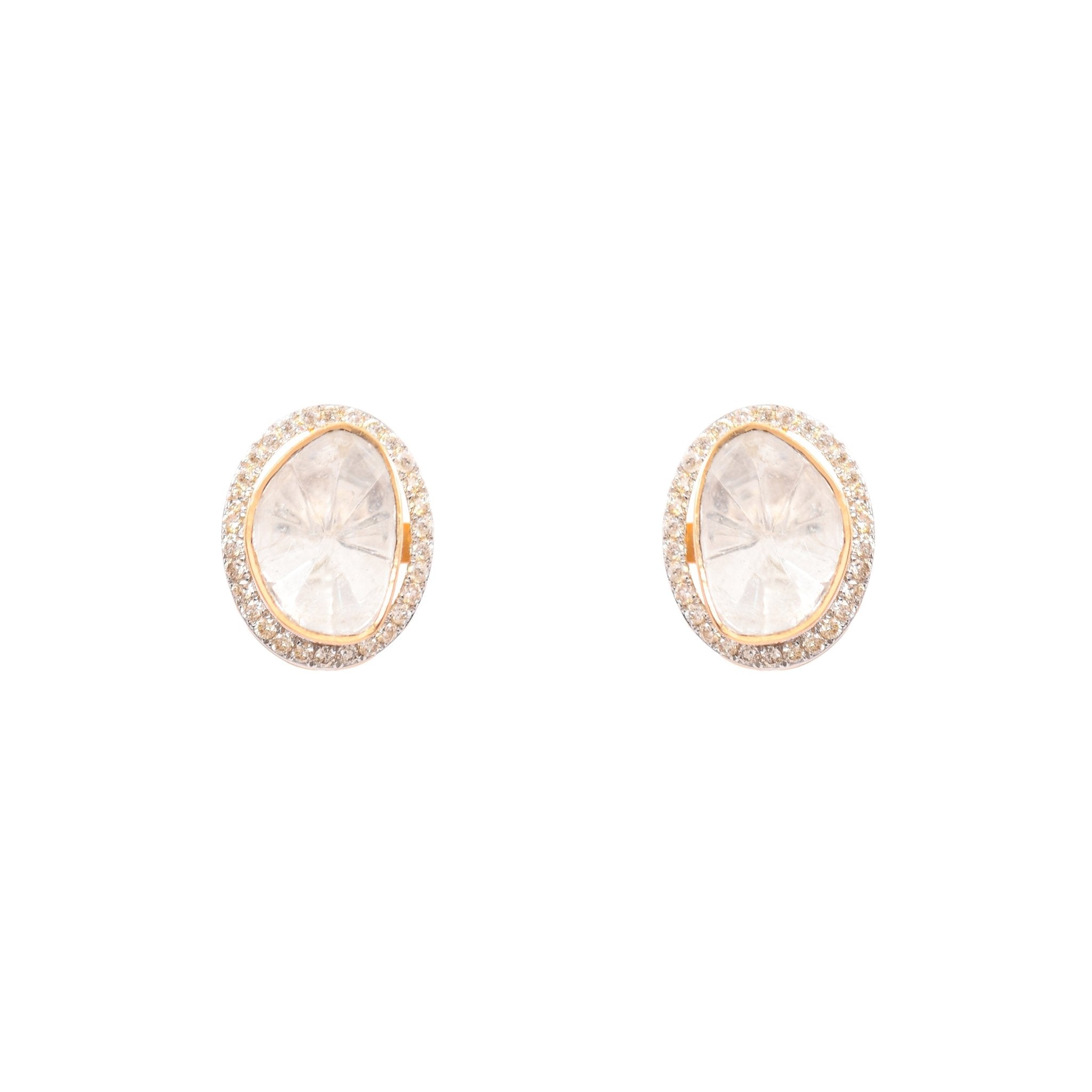 Classic diamond polki studs presented flat on mirrored surface.