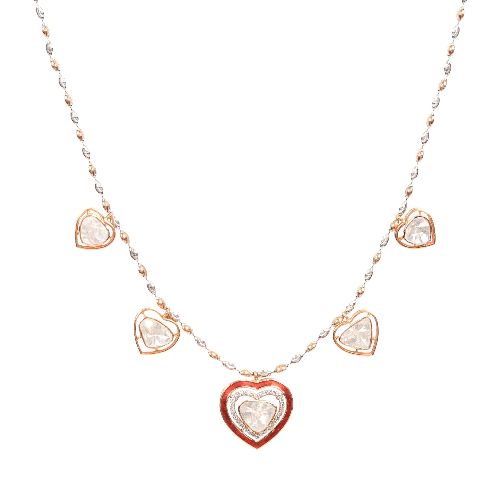 Heart-shaped Polki diamond necklace with a delicate pink tassel finish