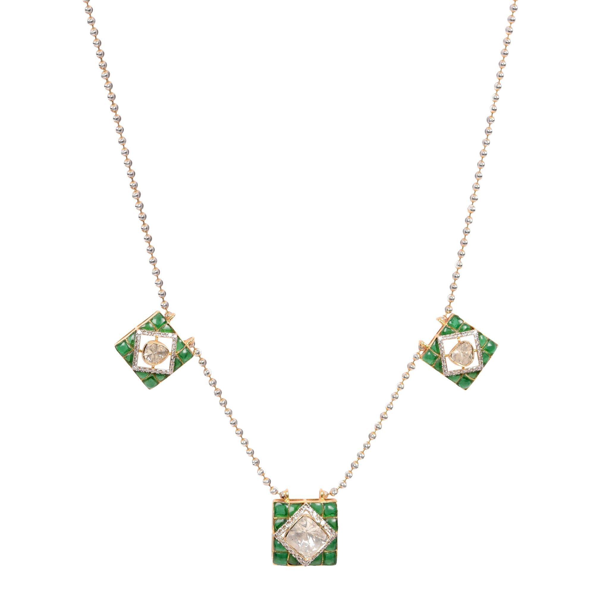 Model showcasing The Emerald Artistry necklace with majestic green hues