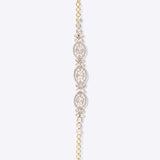 Whimsicle Diamond Polki Bracelet in 14k gold with floral motifs and oval Polki diamonds.