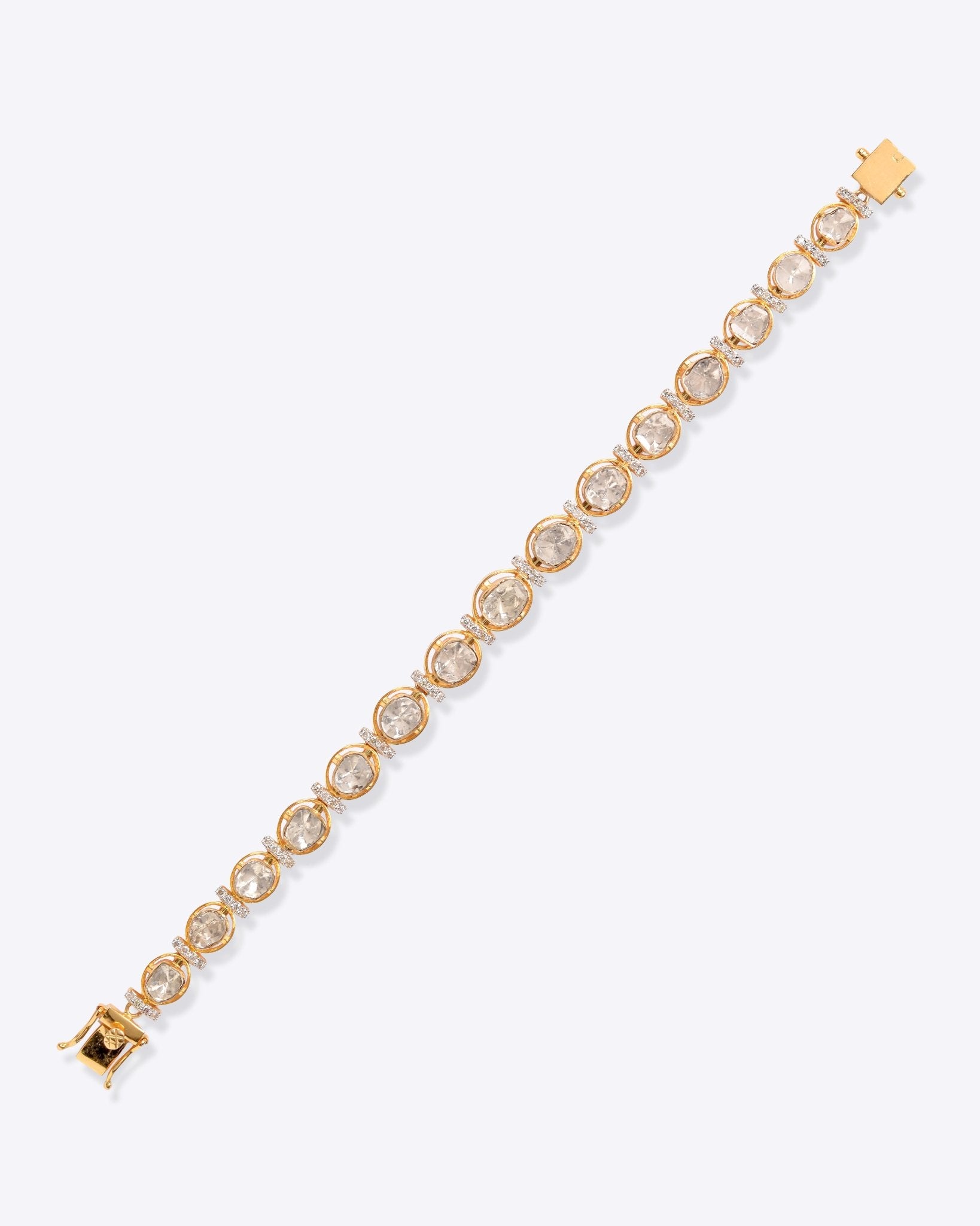 18K gold linear bracelet set with Polki diamonds.