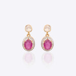 Gold earrings with ruby center stone and dangling Polki diamond