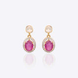 Gold earrings with ruby center stone and dangling Polki diamond