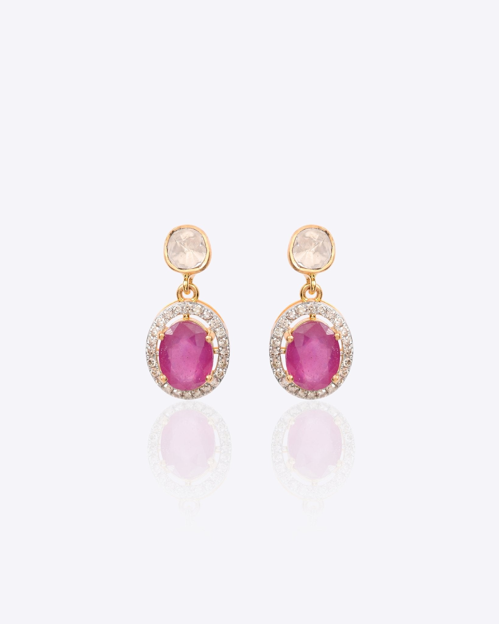 Gold earrings with ruby center stone and dangling Polki diamond