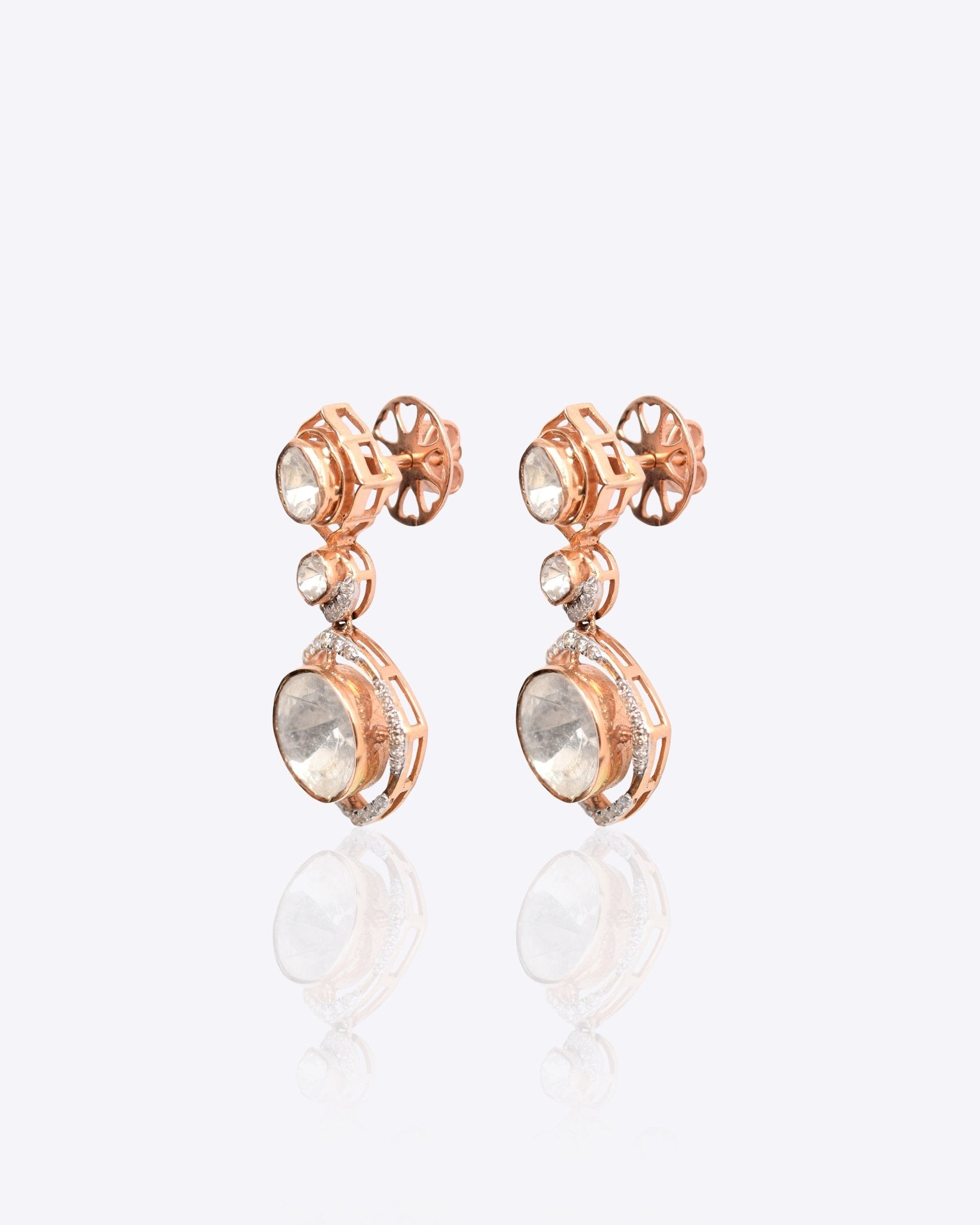 18k gold Noori earrings with Polki diamonds in a constellation-inspired design.