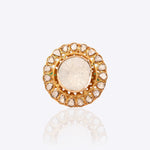 Sunburst Polki Ring in 14K gold with a central Polki halo of Zambian emeralds.