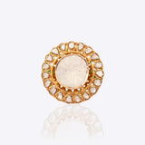 Sunburst Polki Ring in 14K gold with a central Polki halo of Zambian emeralds.