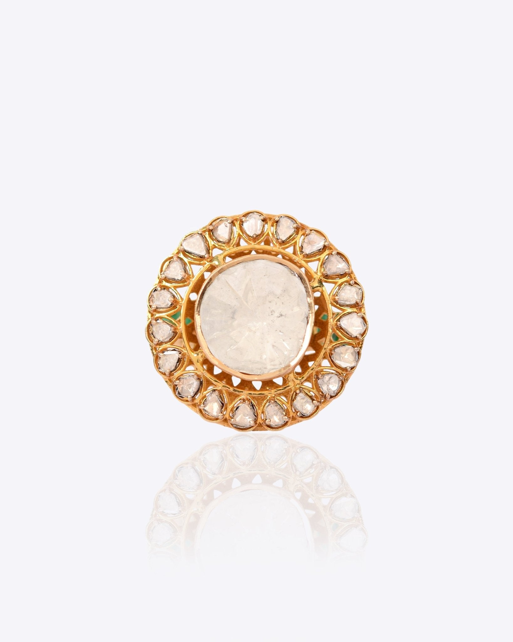 Sunburst Polki Ring in 14K gold with a central Polki halo of Zambian emeralds.
