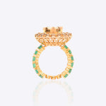 Sunburst Polki Ring in 14K gold with a central Polki halo of Zambian emeralds.