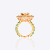 Sunburst Polki Ring in 14K gold with a central Polki halo of Zambian emeralds.
