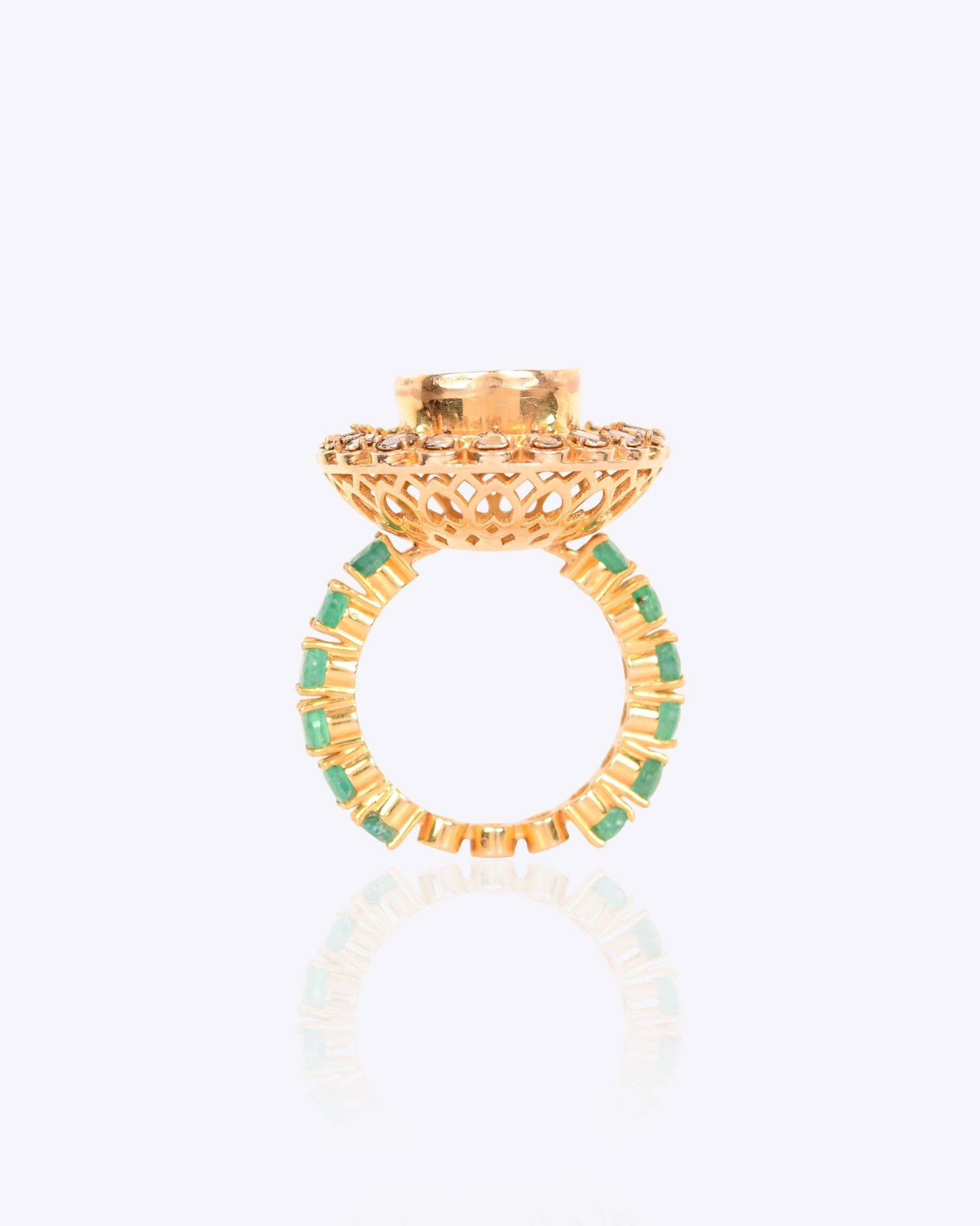 Sunburst Polki Ring in 14K gold with a central Polki halo of Zambian emeralds.