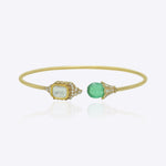 9K gold open cuff bracelet with an asymmetric square Polki and round green stone.