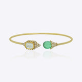 9K gold open cuff bracelet with an asymmetric square Polki and round green stone.