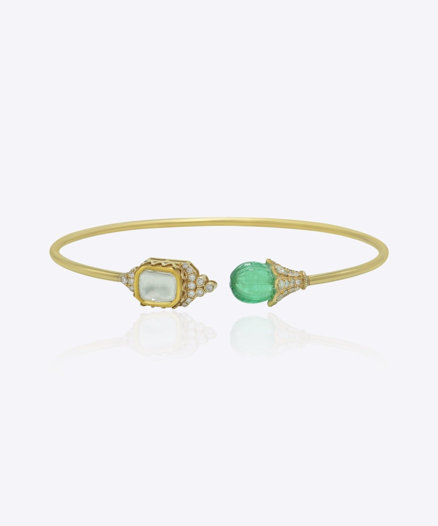 9K gold open cuff bracelet with an asymmetric square Polki and round green stone.