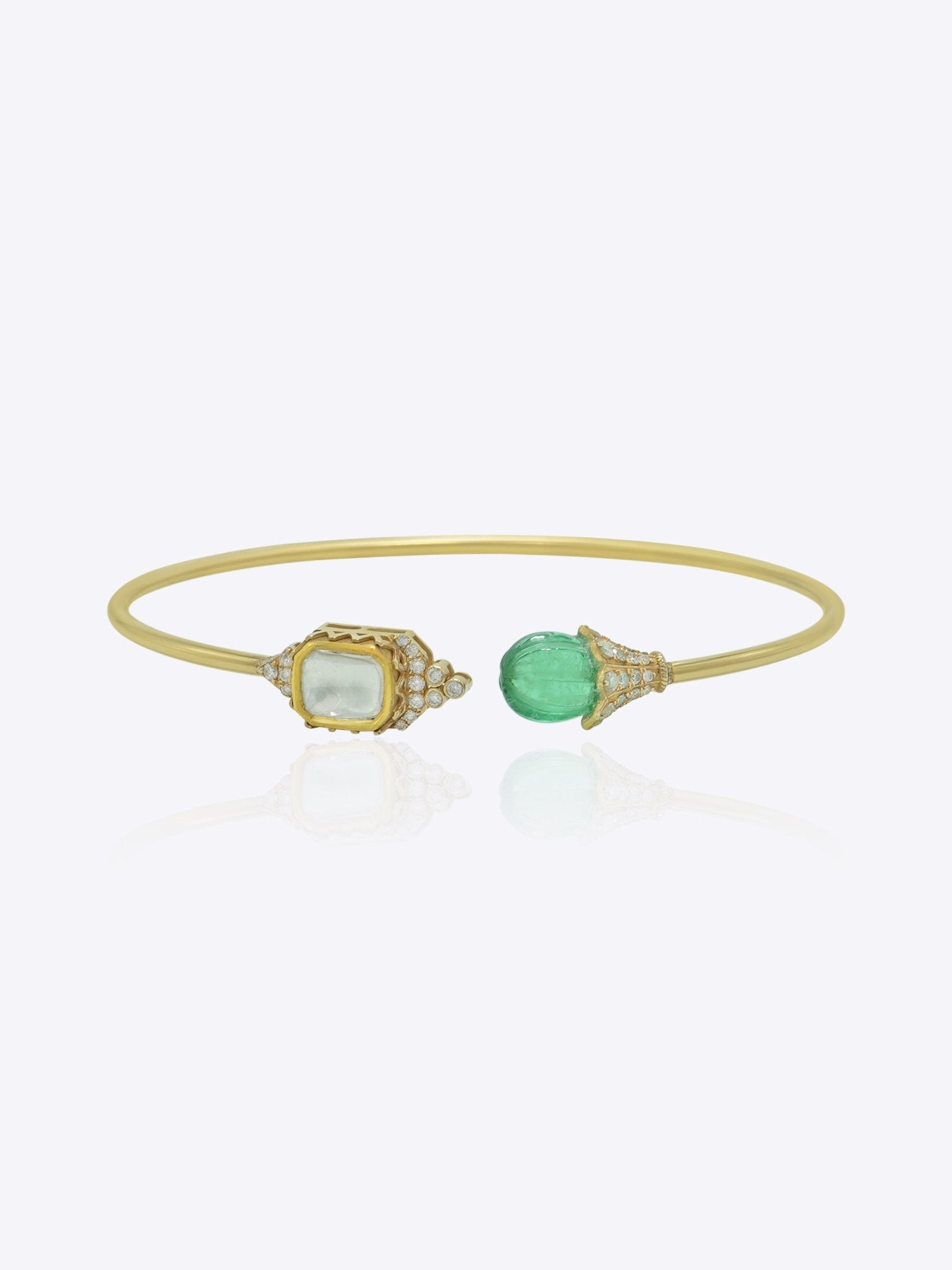 9K gold open cuff bracelet with an asymmetric square Polki and round green stone.