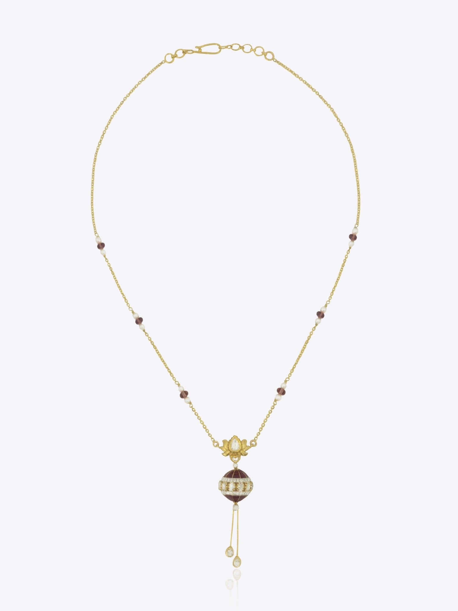 14k gold pendant with spherical design and Polki accent