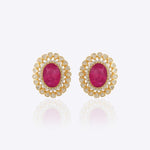 14k gold stud earrings with ruby center and uncut diamond halo