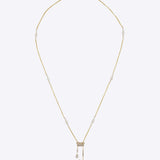 Swastik Sutra Necklace in 14K gold with pearls, Polki, and diamonds around a sacred Swastik.