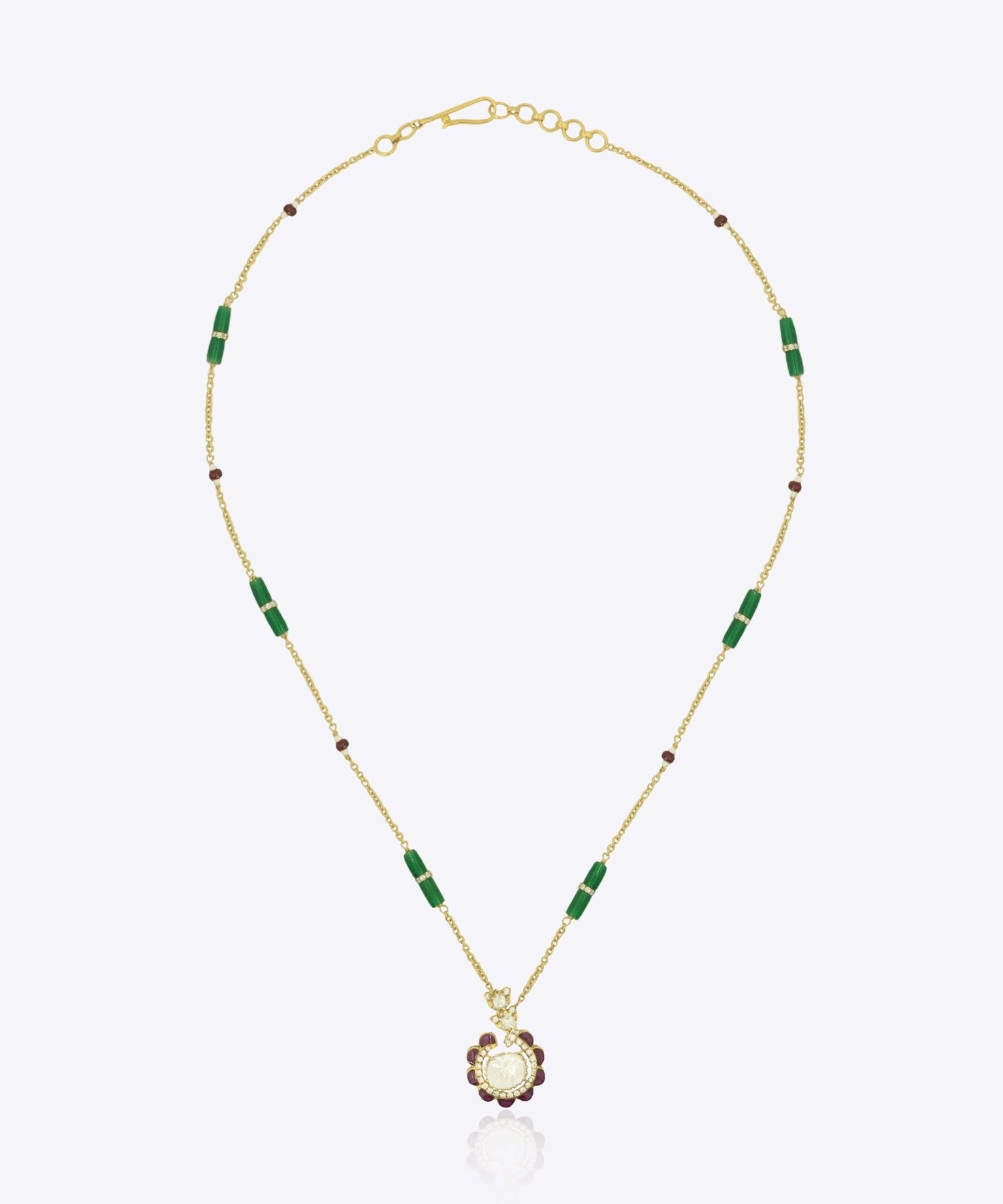 9k gold elegant necklace with circular Polki pendant and ruby detailing