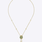 9k gold Luminous Orb necklace with spherical centerpiece and dual Polki drop chains