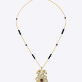 14K gold Obsidian Petal necklace with Polki, diamonds, and black onyx in a floral design.