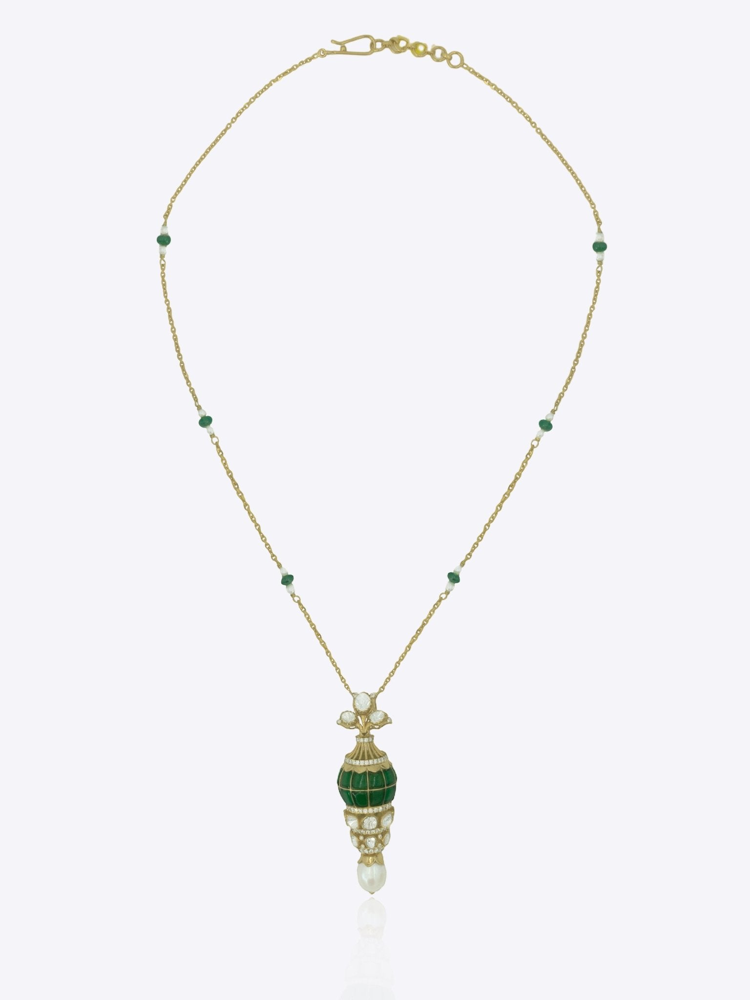 Sheesh Mahal Pendant in gold with an emerald-encrusted orb and Polki diamond petals