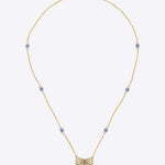 14k gold necklace with Polki, diamonds, and tanzanite accents