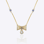 14k gold necklace with Polki, diamonds, and tanzanite accents