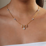 14k gold necklace with Polki, diamonds, and tanzanite accents