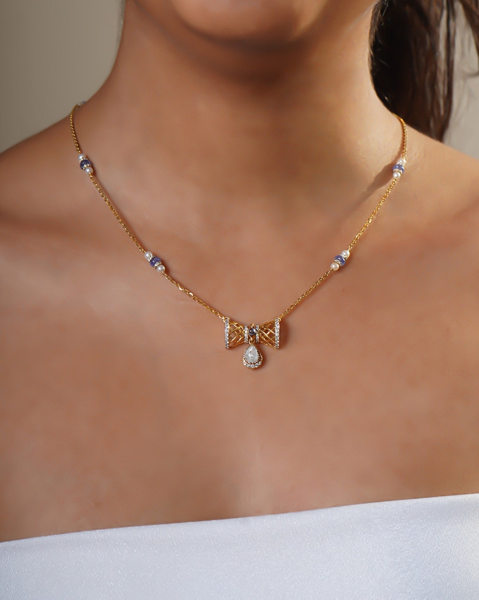 14k gold necklace with Polki, diamonds, and tanzanite accents