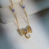 14k gold necklace with Polki, diamonds, and tanzanite accents