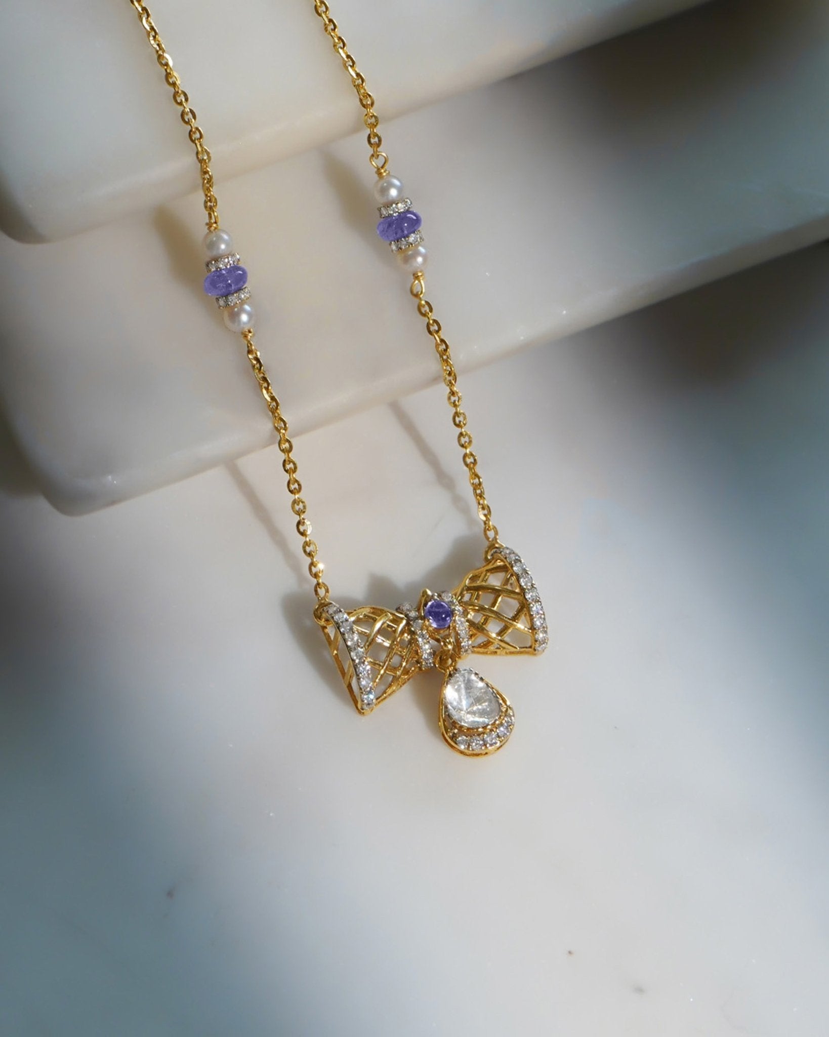 14k gold necklace with Polki, diamonds, and tanzanite accents