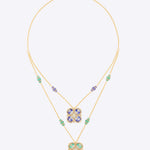 14k gold necklace with layered floral pendants in tanzanite, enamel, and Polki