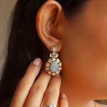 14K gold drop earrings with carved aquamarine centers and Polki diamond accents.