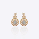 Antique gold Polki earrings photographed flat with emerald drops for wedding wear.