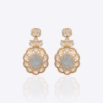14K gold drop earrings with carved aquamarine centers and Polki diamond accents.