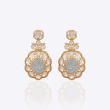 14K gold drop earrings with carved aquamarine centers and Polki diamond accents.