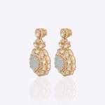 14K gold drop earrings with carved aquamarine centers and Polki diamond accents.