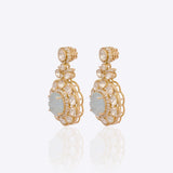 14K gold drop earrings with carved aquamarine centers and Polki diamond accents.